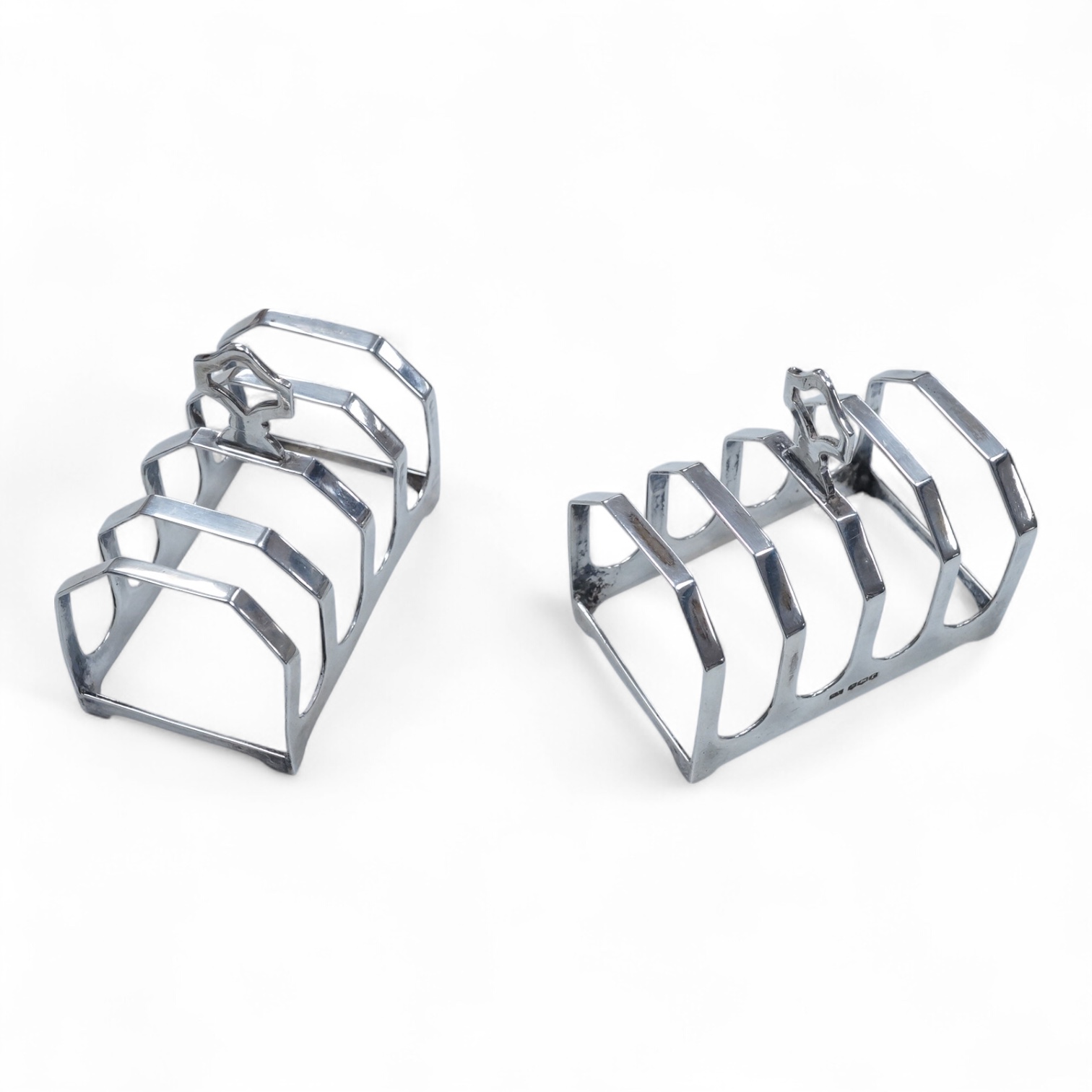 A pair of George V silver five bar toast racks, Viners Ltd, Sheffield, 1934, 75mm, 3.6oz.
